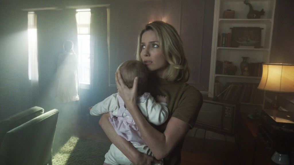 Annabelle Wallis holding baby in Annabelle