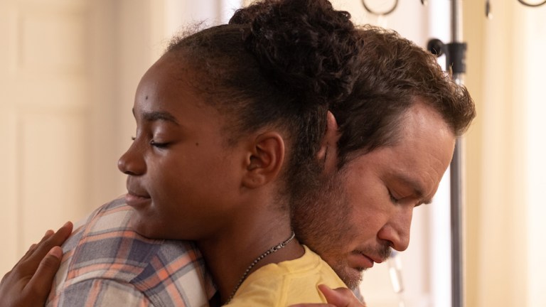 Amy and Brad hug in The Passage