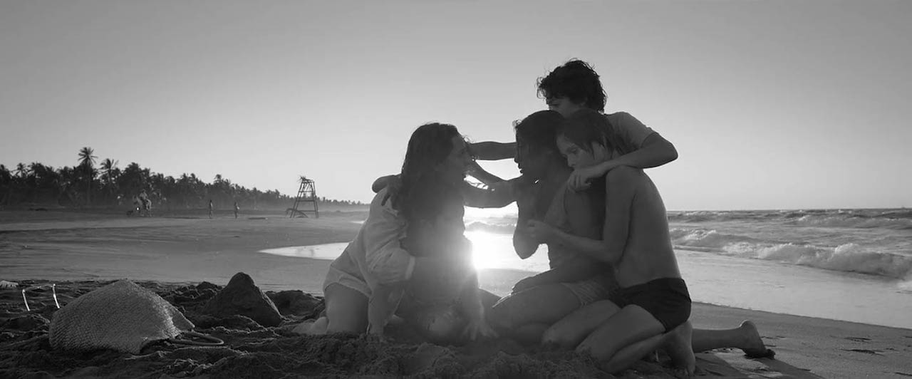 Family on beach in Roma (2018)
