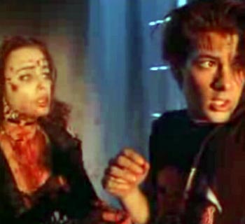 Melinda Clarke and Curt Reynolds in Return Of The Living Dead 3