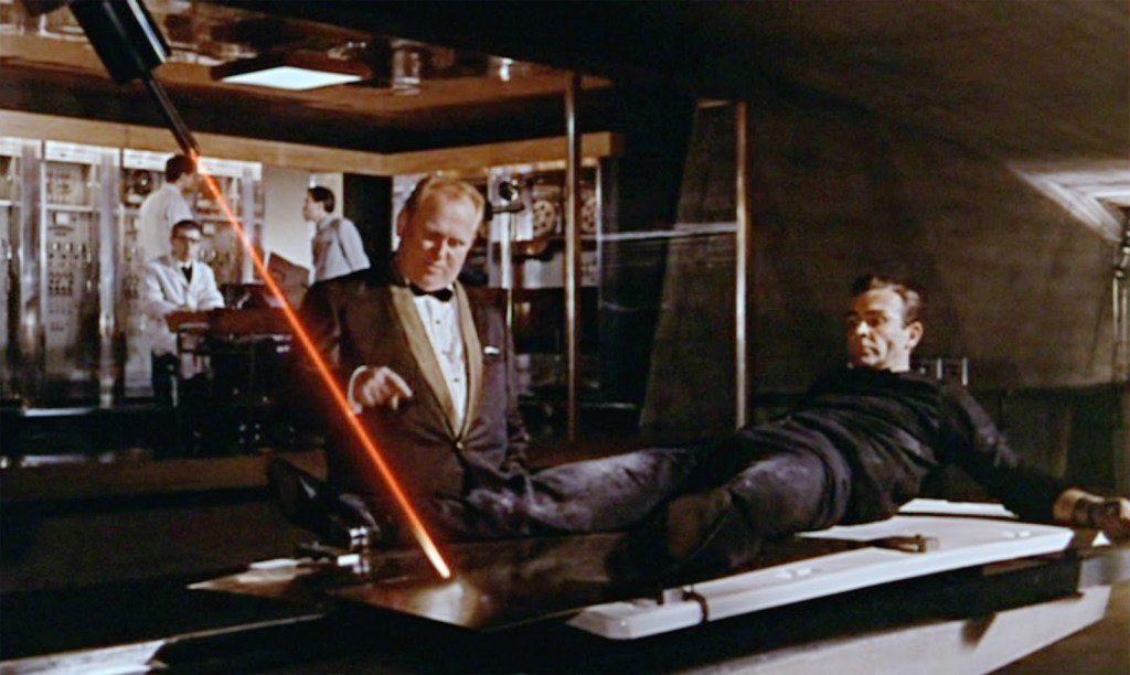 Gert Frobe and Sean Connery in Goldfinger