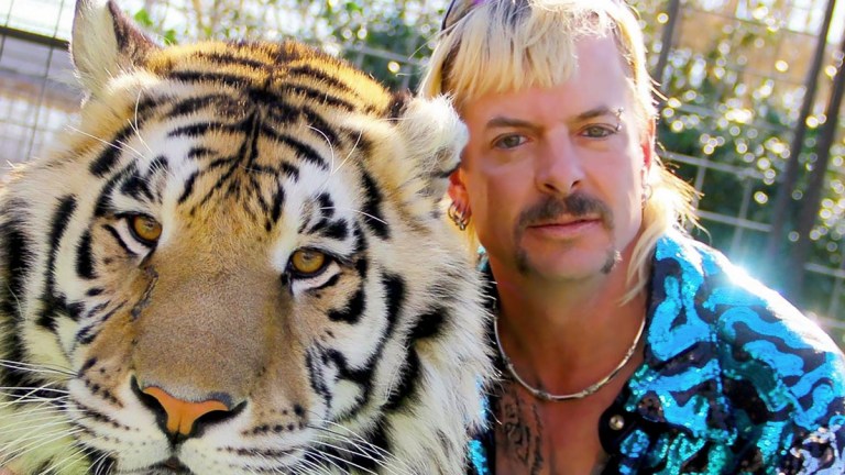 Joe Exotic and a tiger in Tiger King: Murder, Mayhem and Madness