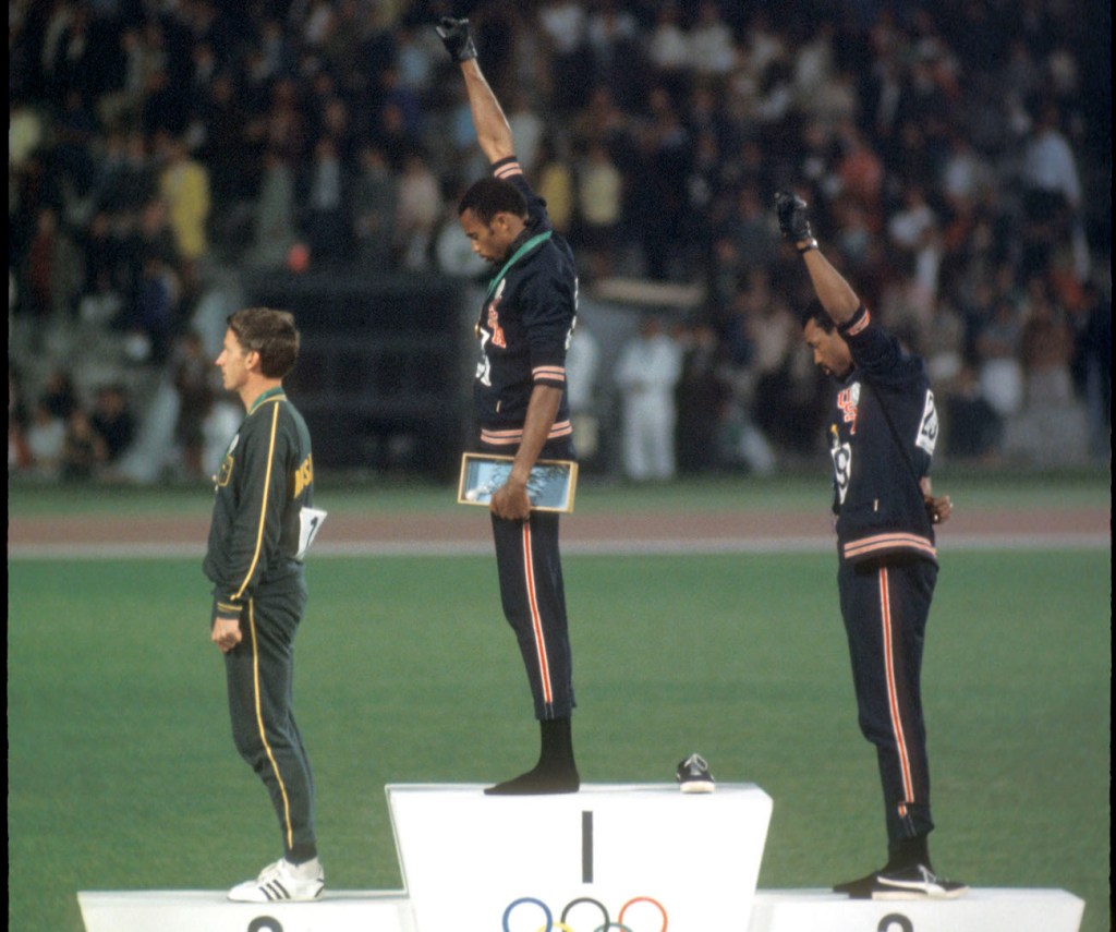 Tommie Smith and John Carlos raise hands in solidarity with Black Power