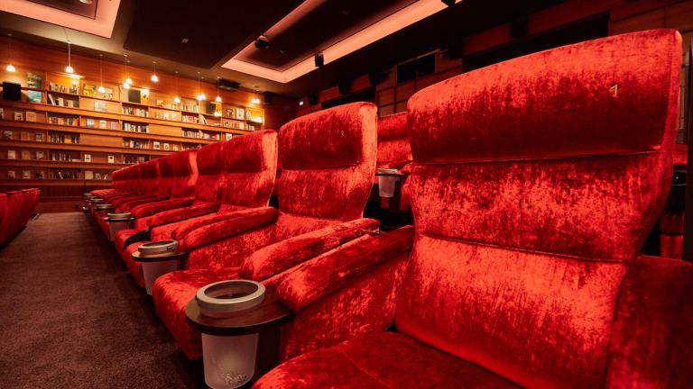 Empty luxury movie theater chairs