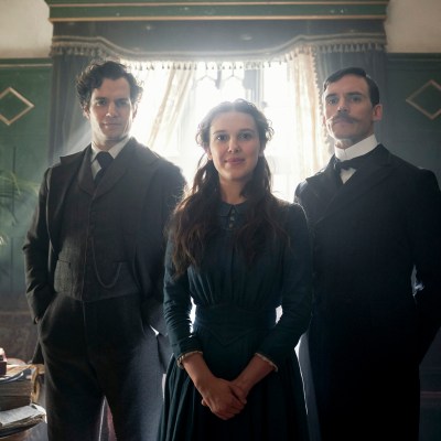 ENOLA HOLMES (L to R) HENRY CAVILL as SHERLOCK HOLMES, MILLIE BOBBY BROWN as ENOLA HOLMES, SAM CLAFLIN as MYCROFT HOLMES.