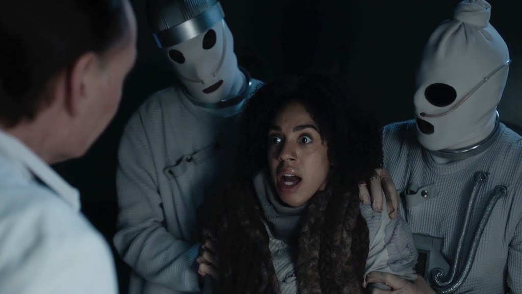 Bill is Held by Two Cybermen in Doctor Who