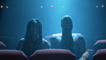 Couple sitting in dark movie theater - Monsterland