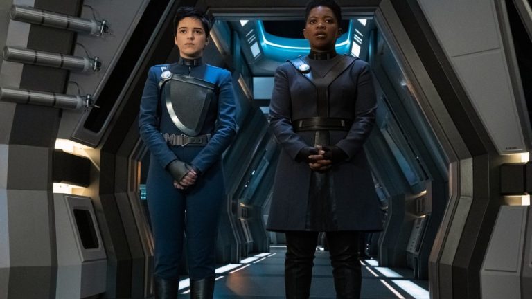 Blu del Barrio as Adira and Phumzile Sitole as Captain Ndoye Stand in a Starship Hall in Star Trek: Discovery Season 3 Episode 3