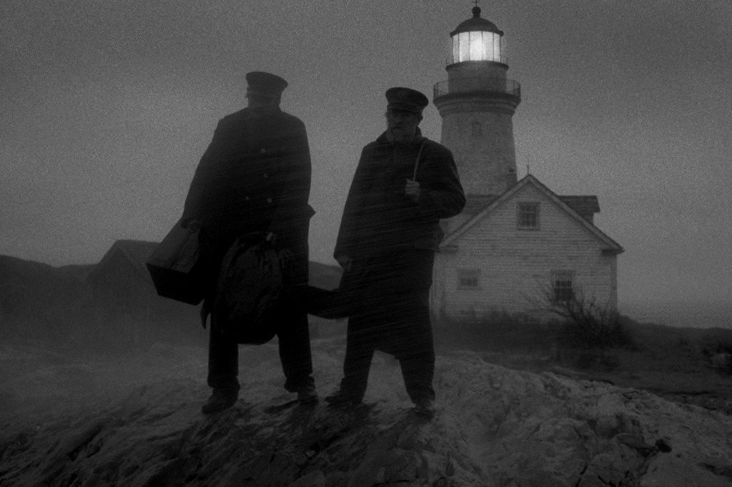 Willem Dafoe and Robert Pattinson in The Lighthouse at night