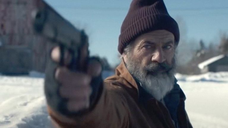 Mel Gibson as Santa Claus with a Gun