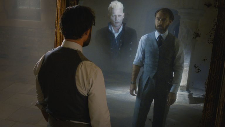 Jude Law as Dumbledore Looks Into the Mirror of Erised in Fantastic Beasts: The Crimes of Grindelwald