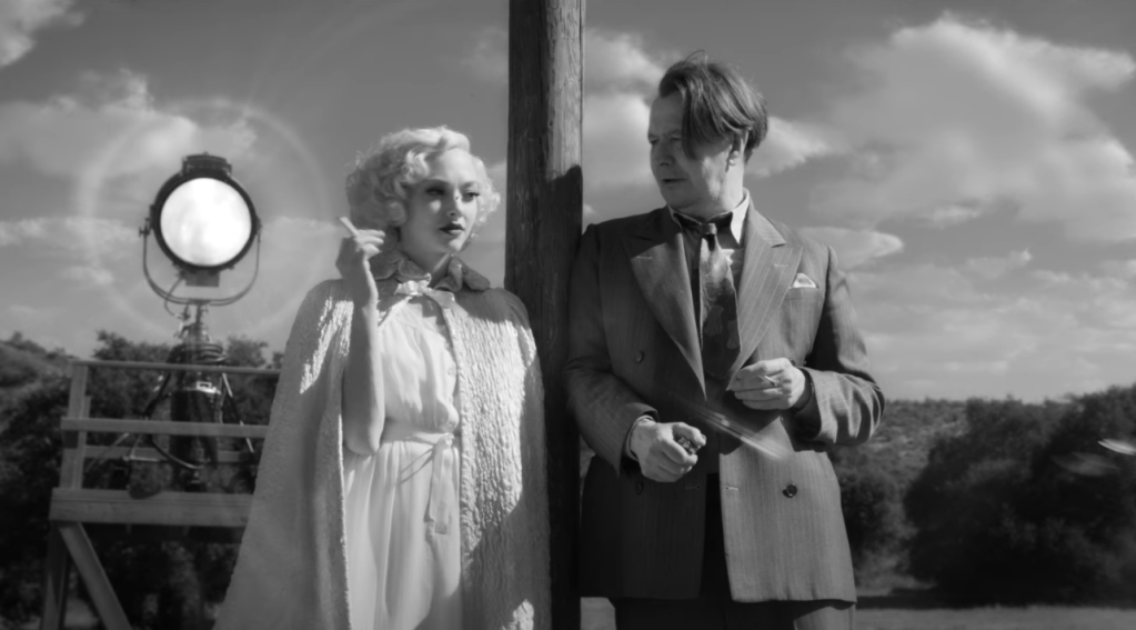 Amanda Seyfried as Marion Davies and Gary Oldman as Herman Mankiewicz in Mank.