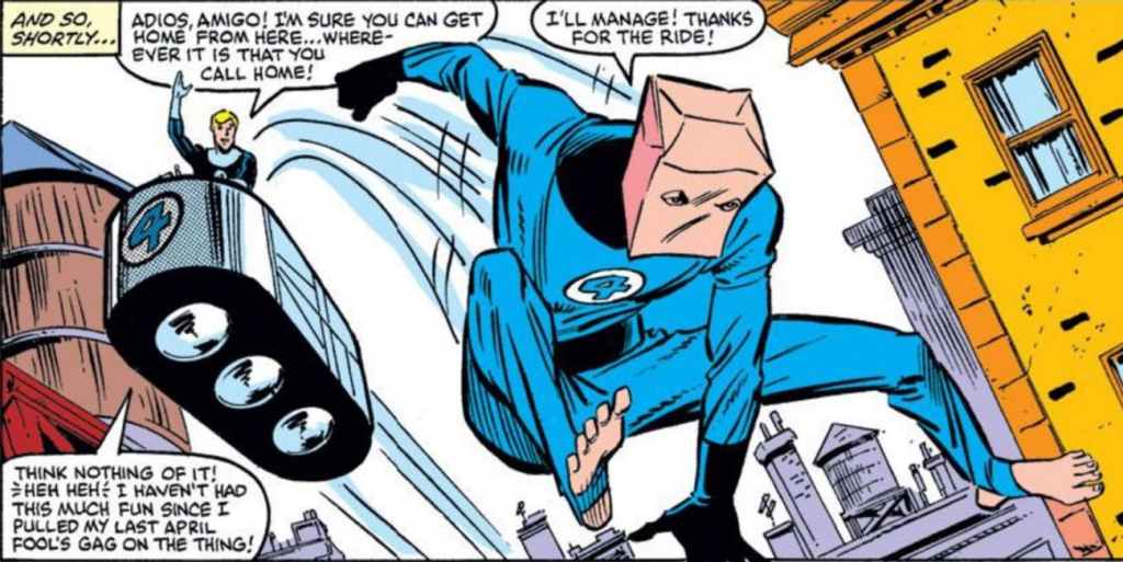 Spider-Man wearing a Fantastic Four costume and a paper bag over his head.