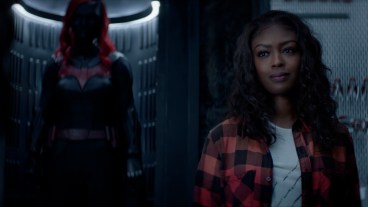 Jacivia Leslie as Ryan stands in front of the Batsuit in Batwoman Season 2