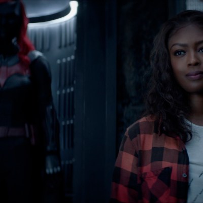 Jacivia Leslie as Ryan stands in front of the Batsuit in Batwoman Season 2