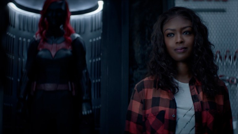 Jacivia Leslie as Ryan stands in front of the Batsuit in Batwoman Season 2