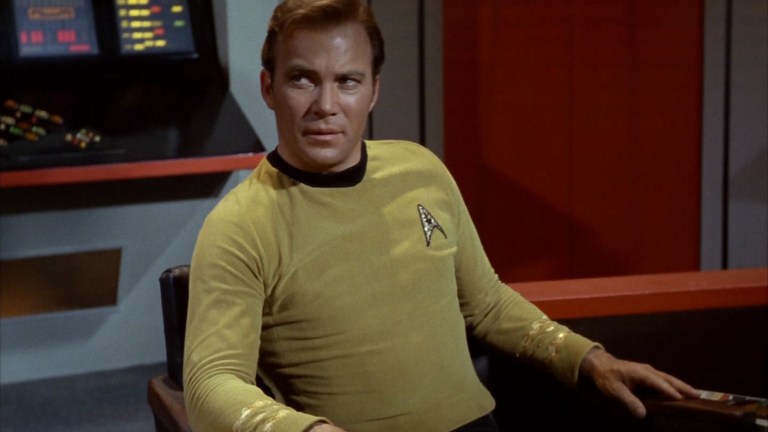 William Shatner as Captain Kirk sits on the bridge of the Enterprise