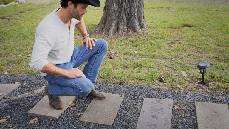 Jared Padalecki as Cordell Walker kneels by a gravestone