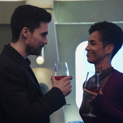 Holden and Naomi make a toast in The Expanse