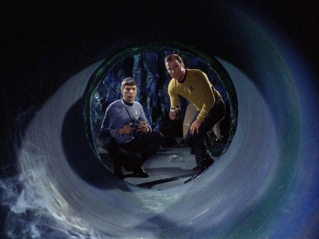 Spock and Kirk look into a tunnel in "Devil in the Dark"