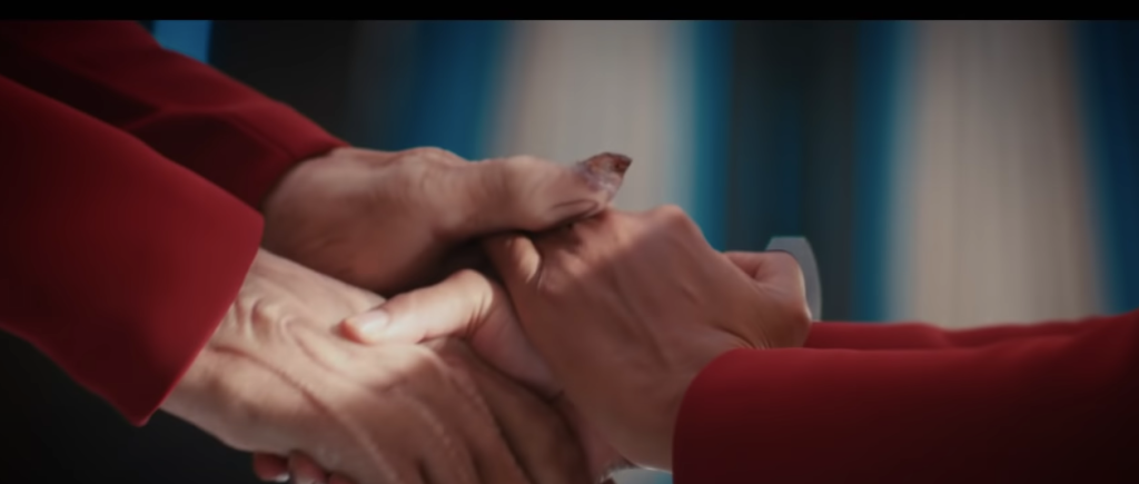 Saru and Burnham holding hands