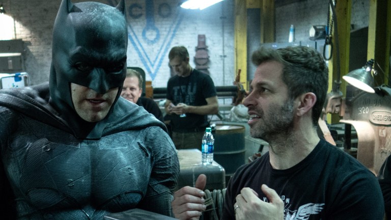 Ben Affleck as Batman, joined by Zack Snyder on the Justice League set.