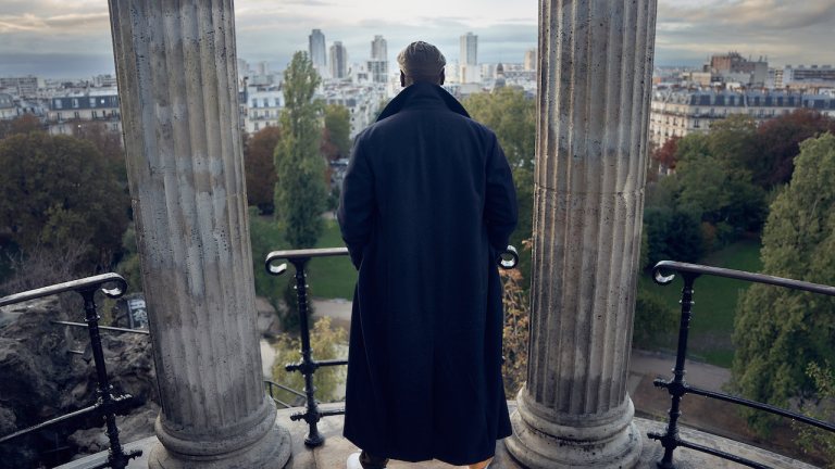 Assane stands overlooking Paris in Lupin Season 2