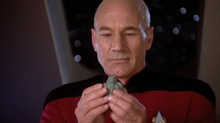 Captain Picard examines an artifact in Star Trek: The Next Generation