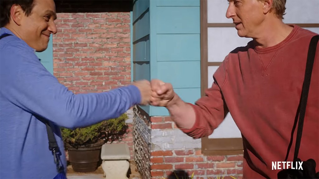 Cobra Kai Season 4; Daniel and Johnny fist-bumping.