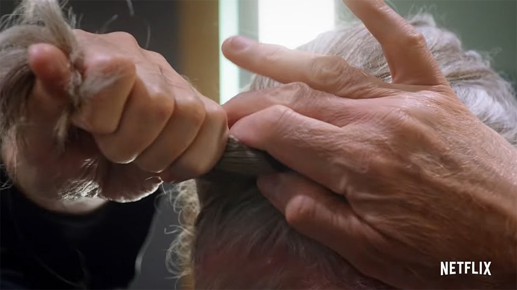 Cobra Kai Season 4; Terry Silver tying his ponytail.