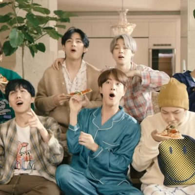 The seven members of BTS goof off together in the music video for "Life Goes On"