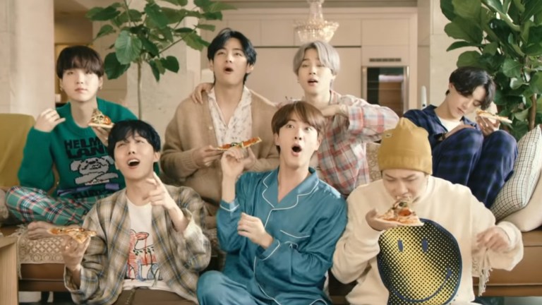 The seven members of BTS goof off together in the music video for "Life Goes On"