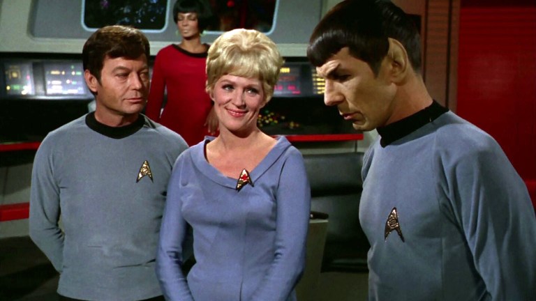 McCoy, Chapel, and Spock on the bridge of the Enterprise, as Uhura stands in the background on Star Trek