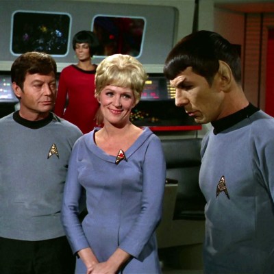 McCoy, Chapel, and Spock on the bridge of the Enterprise, as Uhura stands in the background on Star Trek