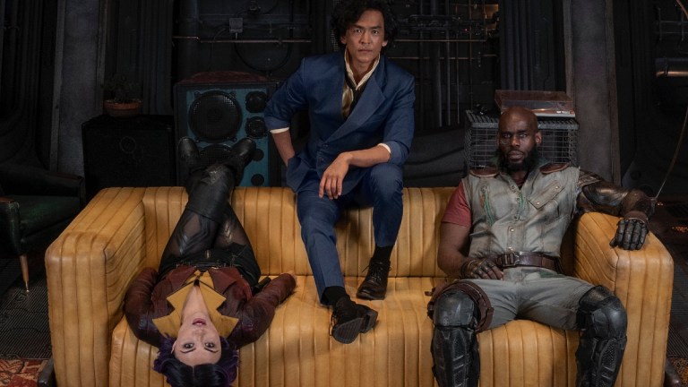 Faye Valentine, Spike Spiegel, and Jet Black on a couch in Netflix's Cowboy Bebop