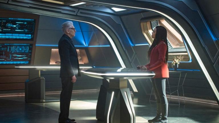 Kovich and Michael stare at one another from either sides of a table in Star Trek: Discovery Season 4 Episode 7