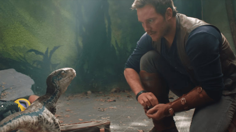 Chris Pratt and baby Blue raptor in Jurassic World Dominion