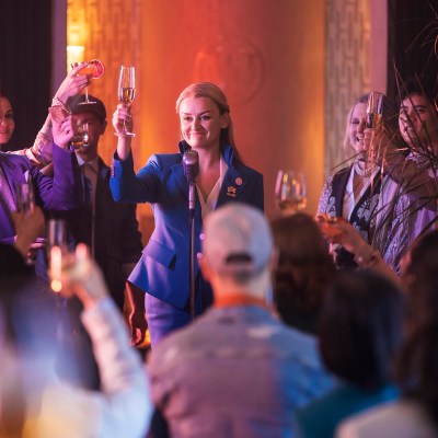 Alison Wright as Ruth leads a toast on Snowpiercer season 3 episode 9.