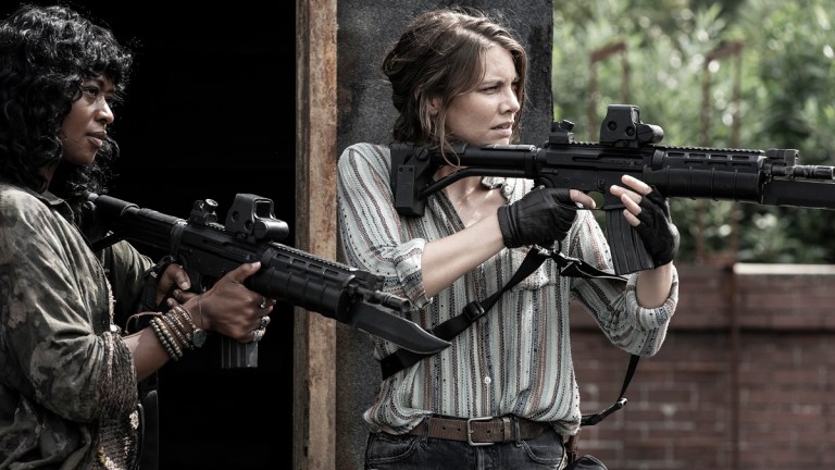 Medina Senghore as Annie and Lauren Cohan as Maggie aim guns in The Walking Dead season 11 episode 14, the rotten core.