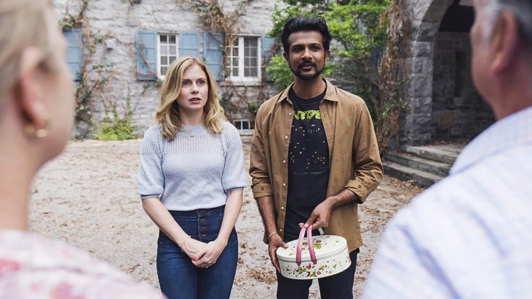 Sam (Rose McIver) and Jay (Utkarsh Ambudkar) meet the neighbors in CBS's Ghosts