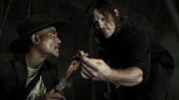 Seth Gilliam and Norman Reedus examine a clue in The Walking Dead season 11 episode 16, acts of God.