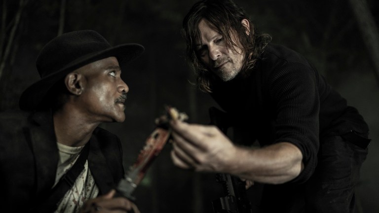 Seth Gilliam and Norman Reedus examine a clue in The Walking Dead season 11 episode 16, acts of God.