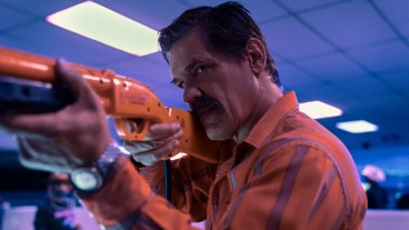 Royal Abbott (Josh Brolin) aims an orange video game rifle in Outer Range
