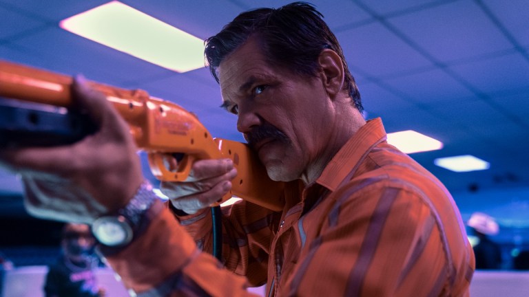 Royal Abbott (Josh Brolin) aims an orange video game rifle in Outer Range