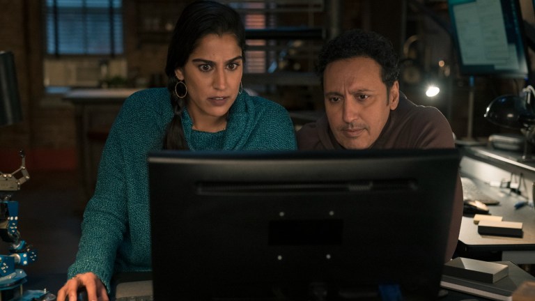 Karima (Sohina Sidhu) and Ben (Actif Mandvi) look at a computer in Evil season 3 episode 2