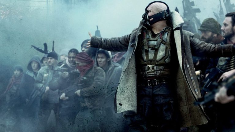 Tom Hardy as Bane with mob in The Dark Knight Rises