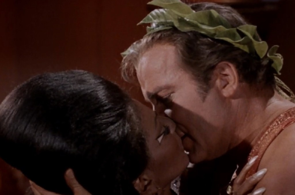The first televised interracial kiss between Nichelle Nichols as Uhura and William Shatner as Kirk in Star Trek: Plato's Stepchildren