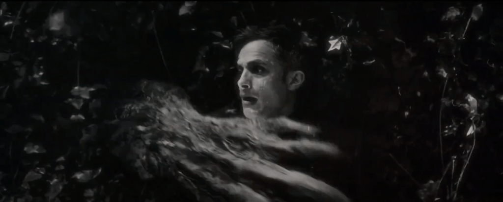 Gael Garcia Bernal and Man-Thing's hand in Marvel's Werewolf by Night