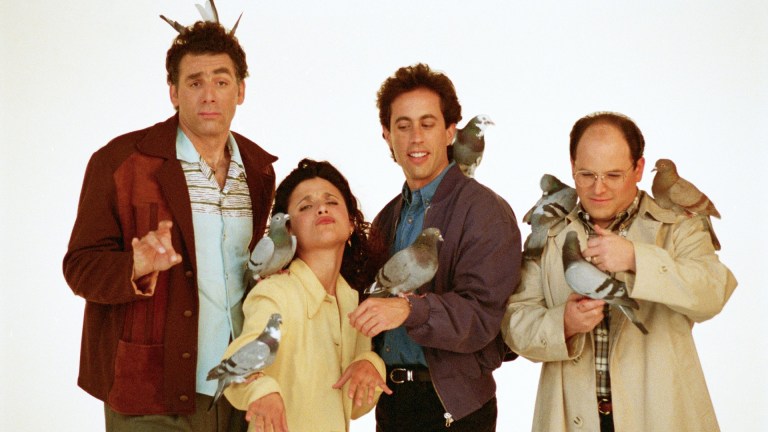 Kramer, Elaine, Jerry, and George holding pigeons in a Seinfeld promotional photo
