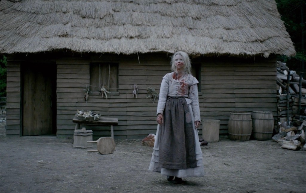 Anya Taylor-Joy covered in blood in The Witch